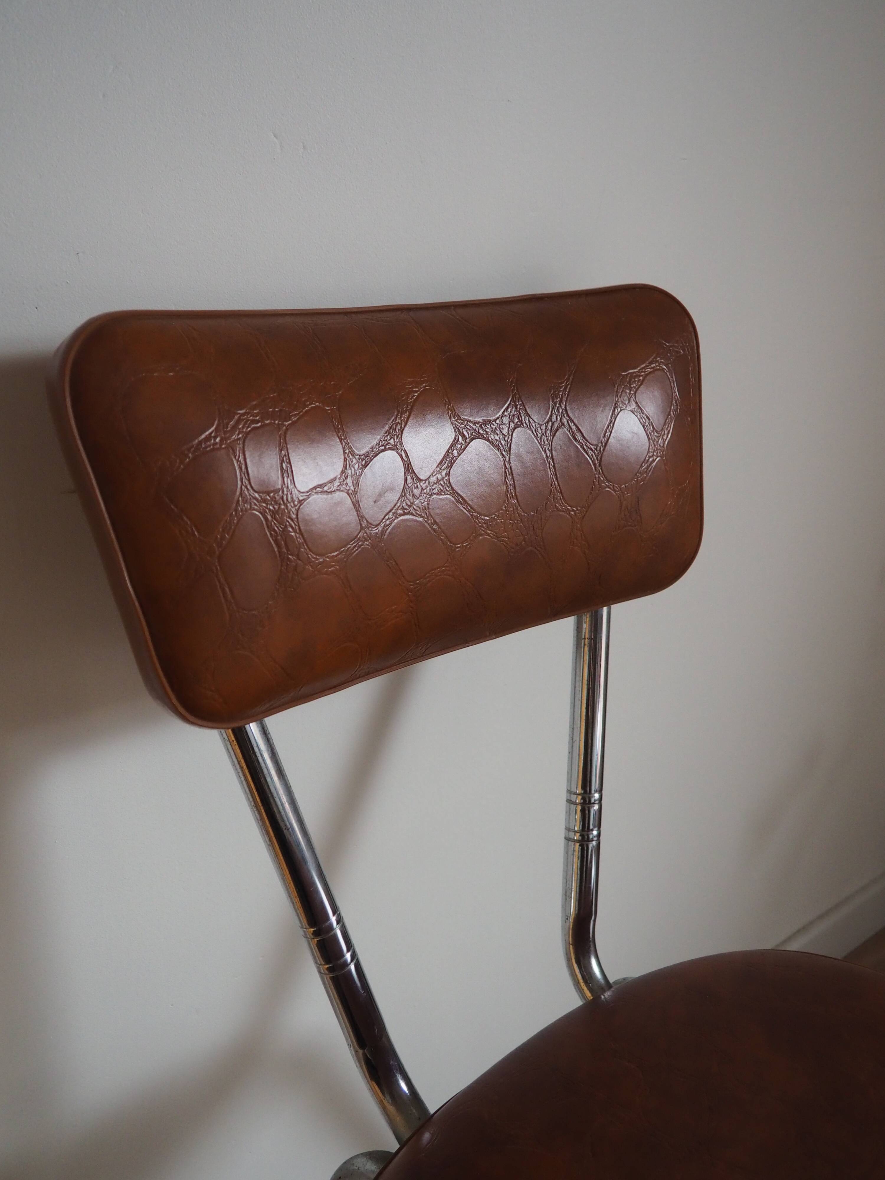Brown faux leather chair