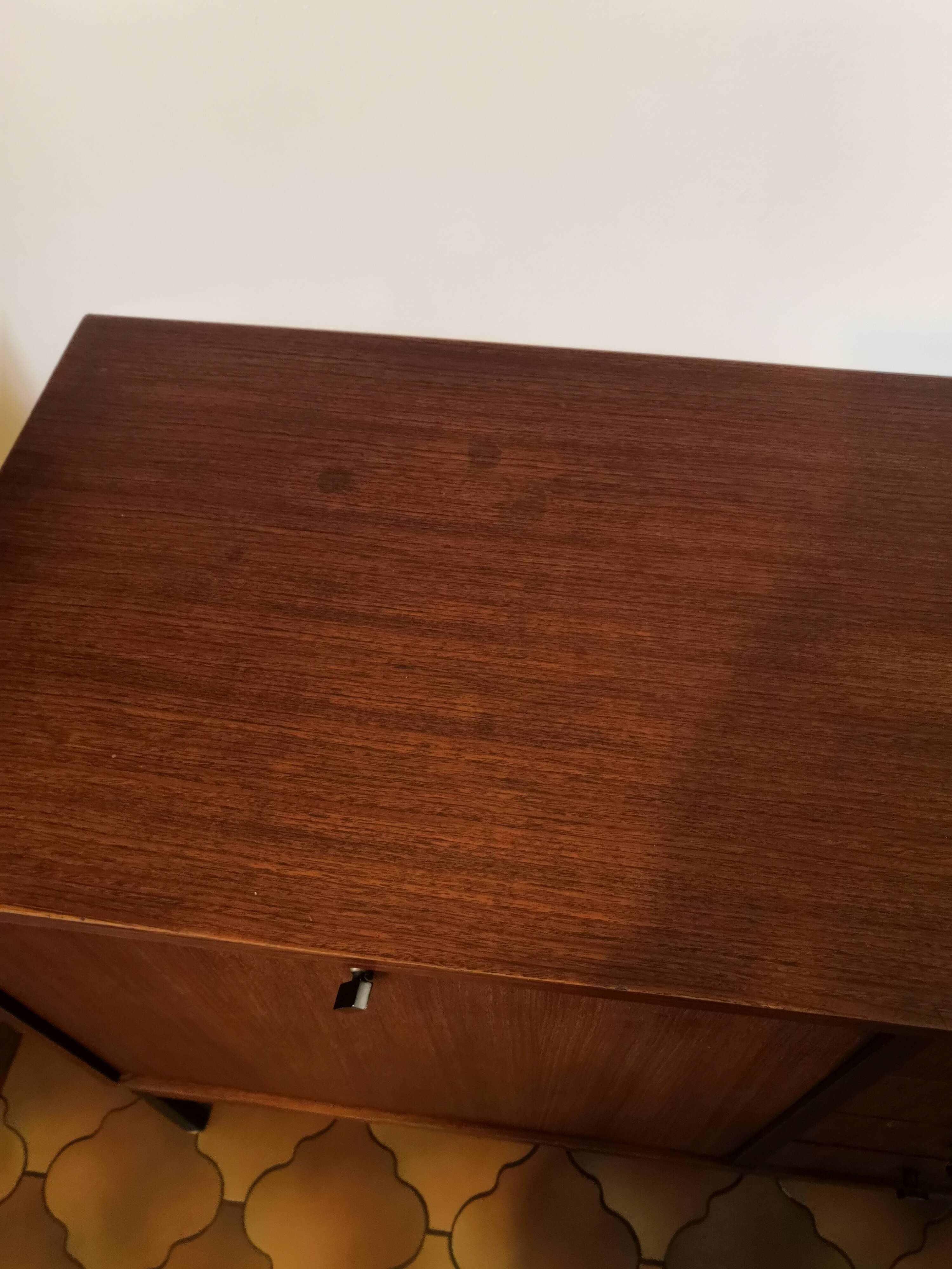 Vintage teak row with metal legs