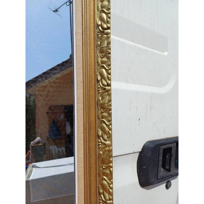 Wooden mirror and gold trim