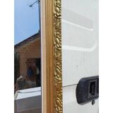 Wooden mirror and gold trim