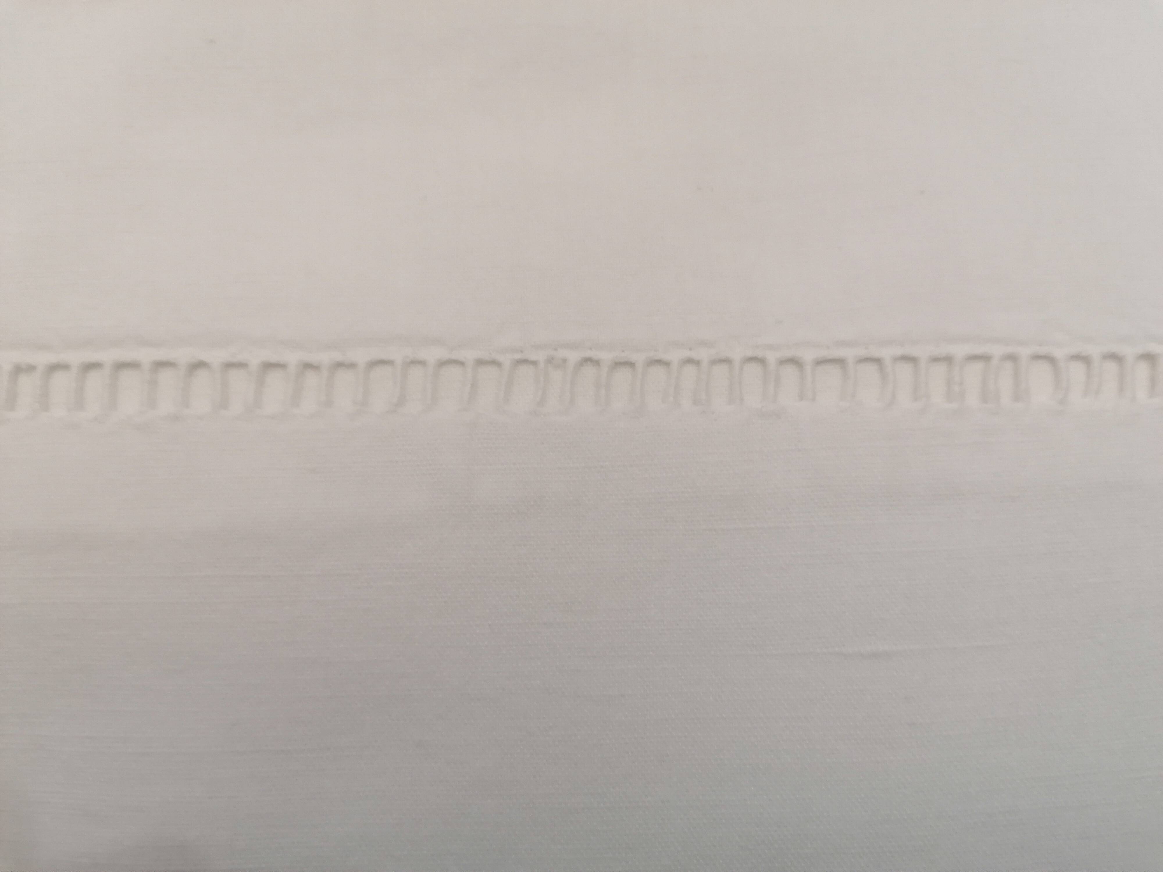 Antique white flat sheet embroidered with “AG”
