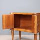 Pair of wooden and glass bedside tables from the 1950s.