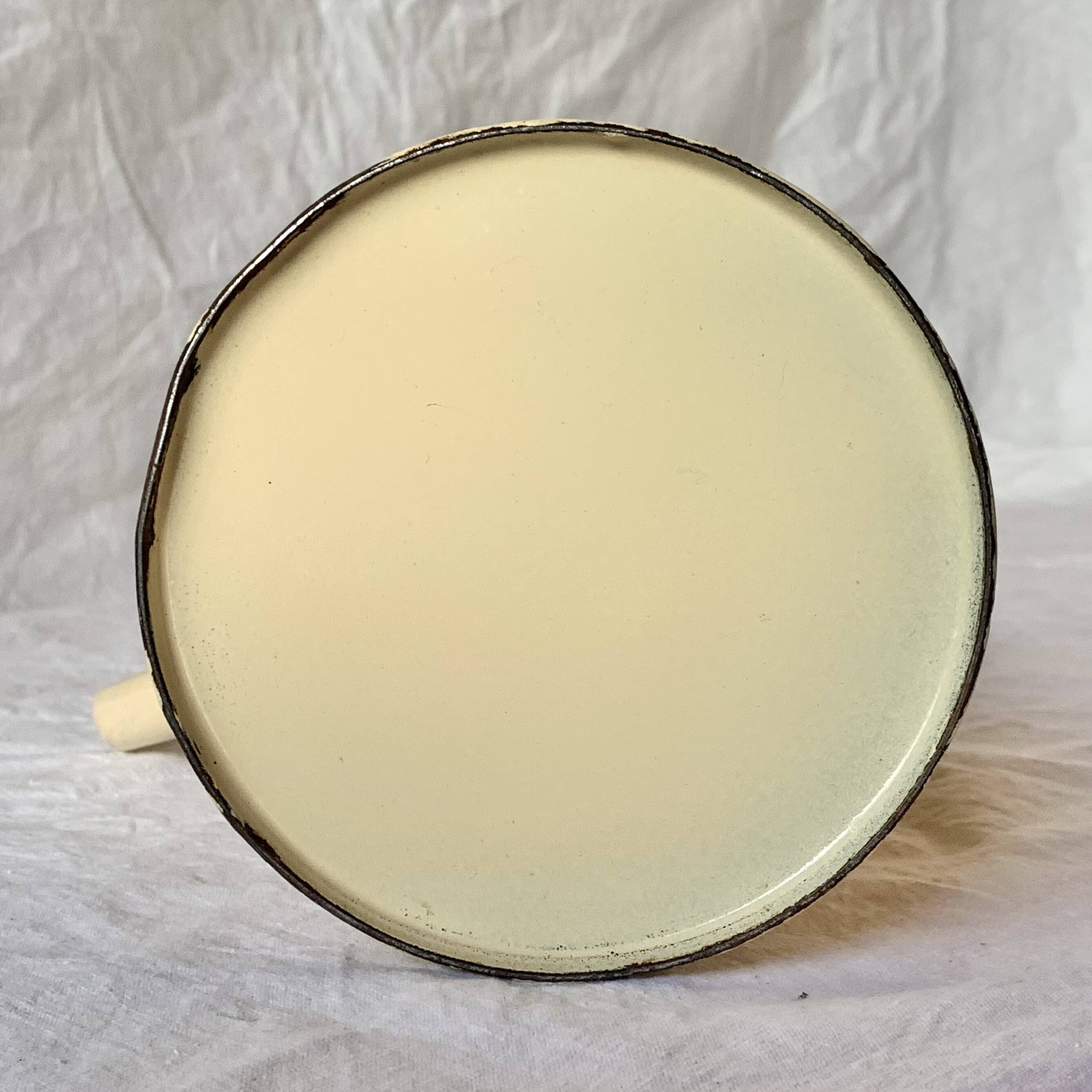 Vintage pitcher or jug in beige enamelled sheet metal