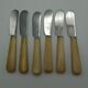 Twelve vintage butter knives