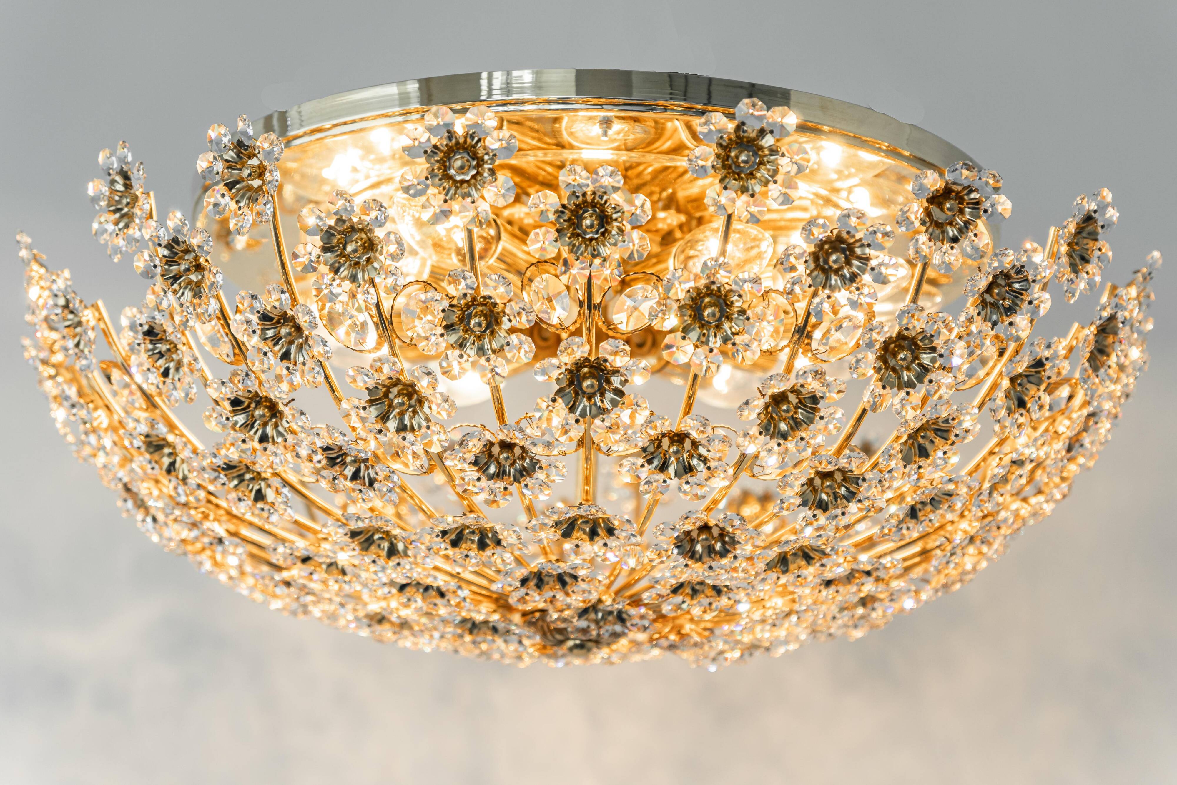 Small delicate ceiling light in gilded brass and cut glass in the shape of flowers by Palwa, Germany, 1970s.