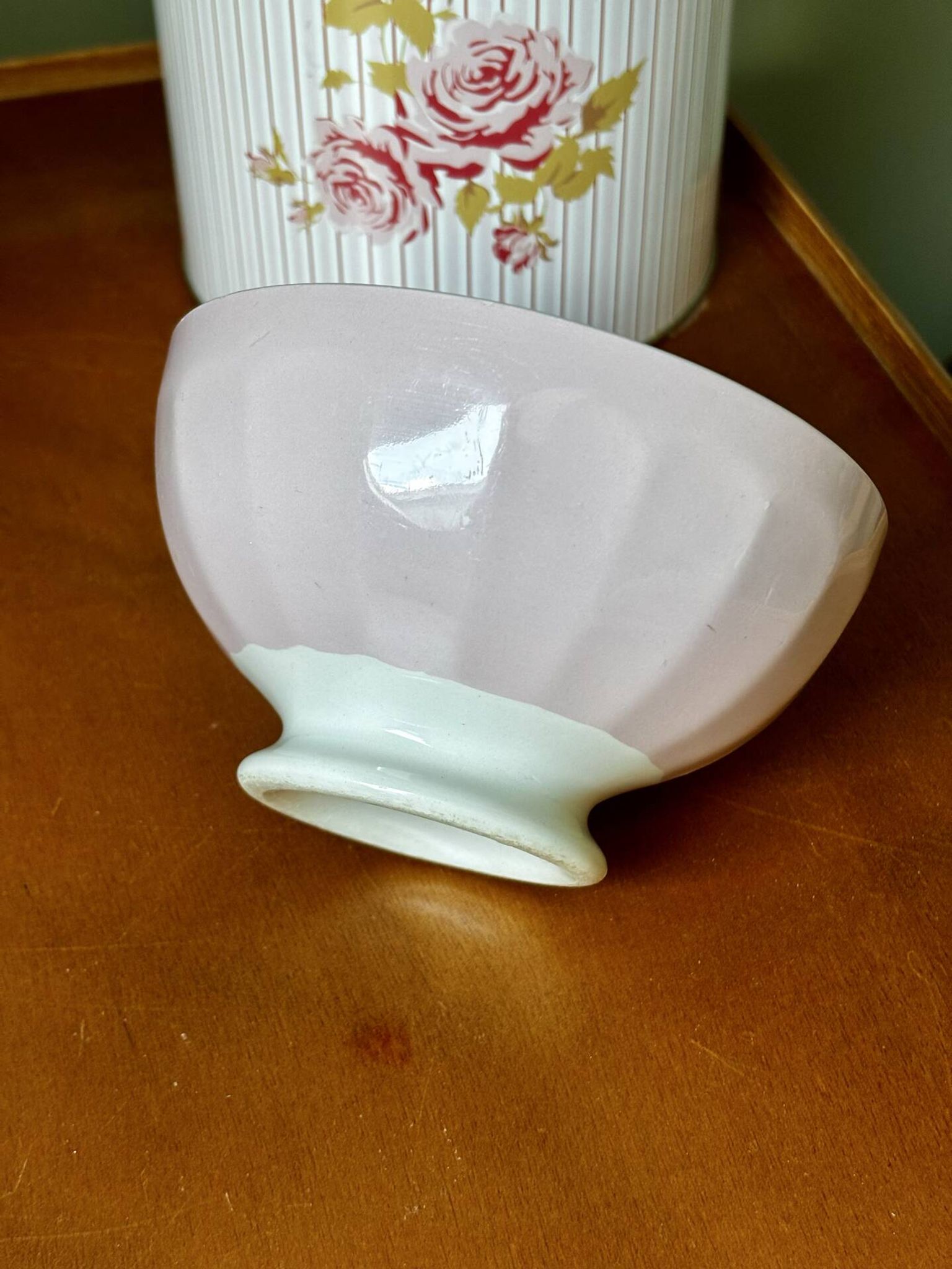 Old faceted bowl in pink earthenware