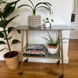 Vintage brass and smoked glass dessert trolley on wheels.