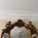 Golden Rococo-style mirror with chest