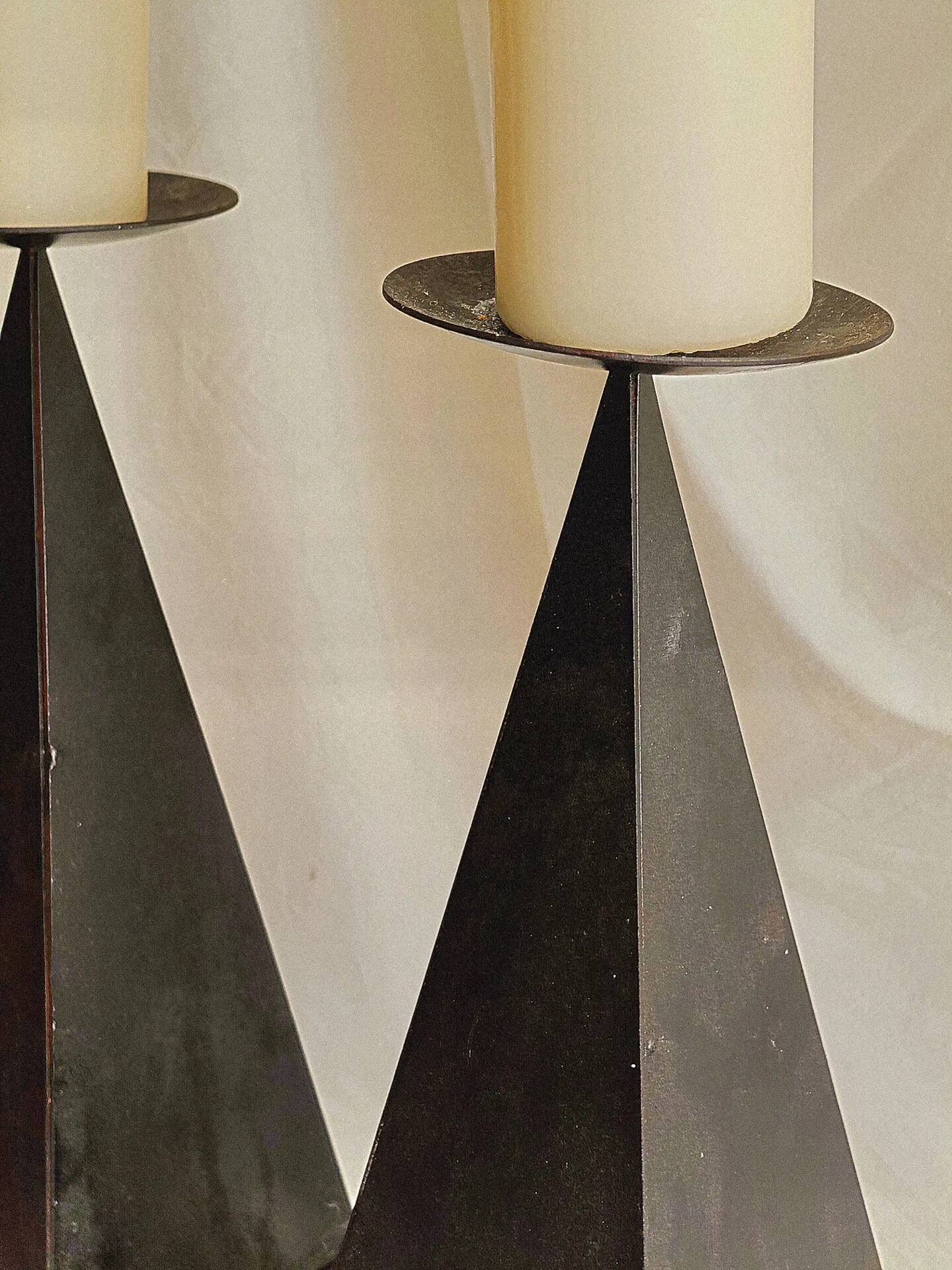 Pair of pyramid-shaped candlesticks in blackened metal (brutalism)