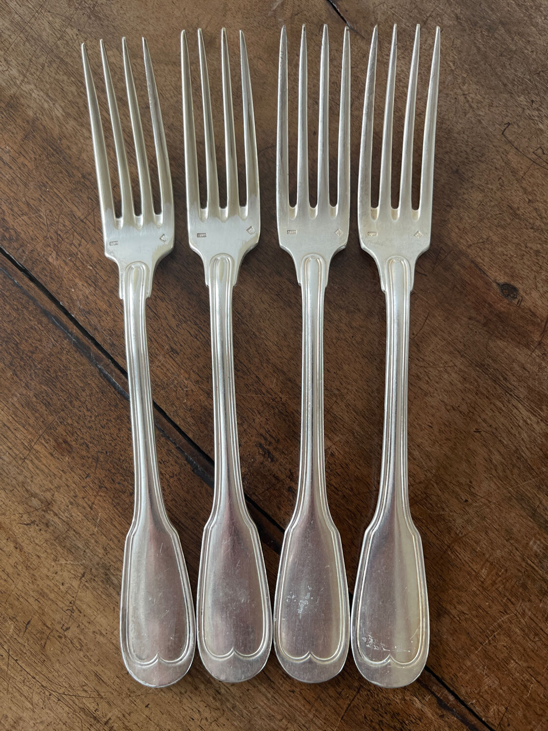 4 silver metal forks