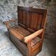 Rustic French antique storage bench from the 18th century in walnut and pine.