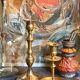 Duo of solid brass and gold metal candle holders worked old
