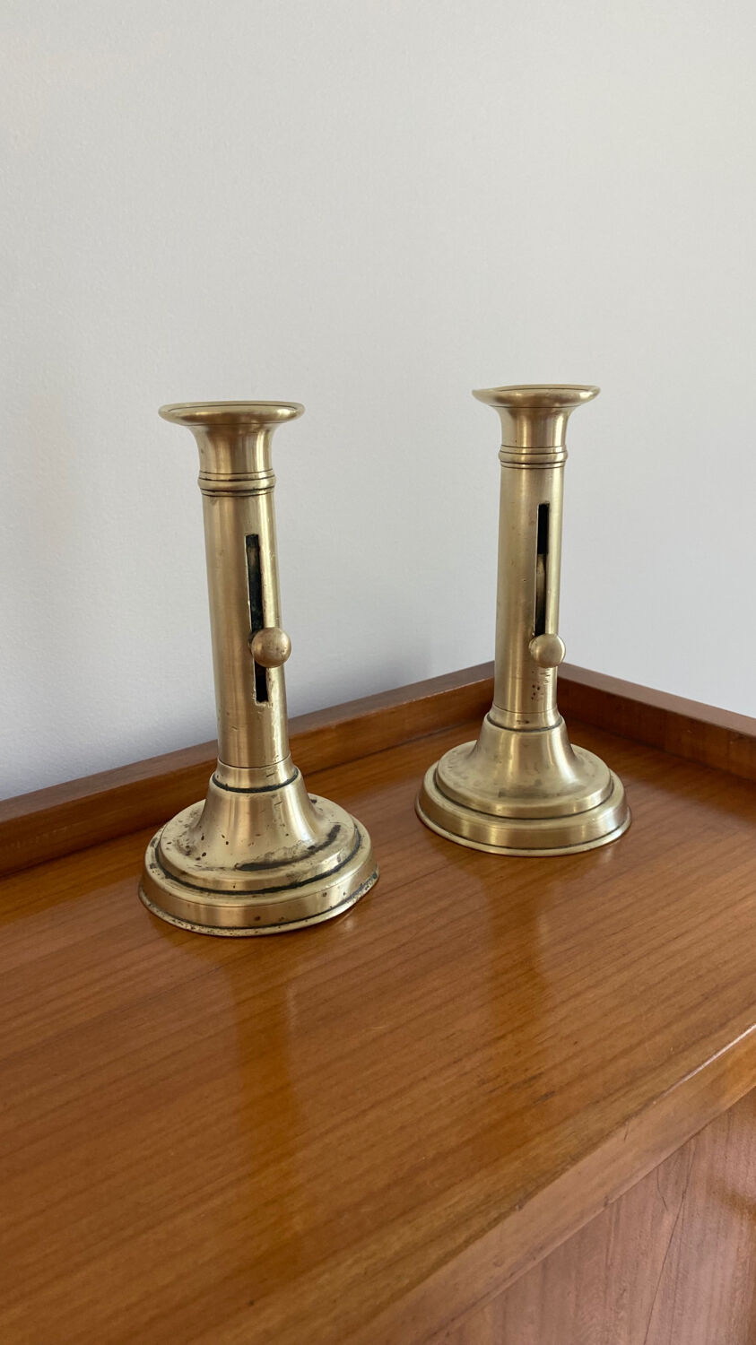 Pair of antique brass push candlesticks
