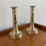 Pair of antique brass push candlesticks