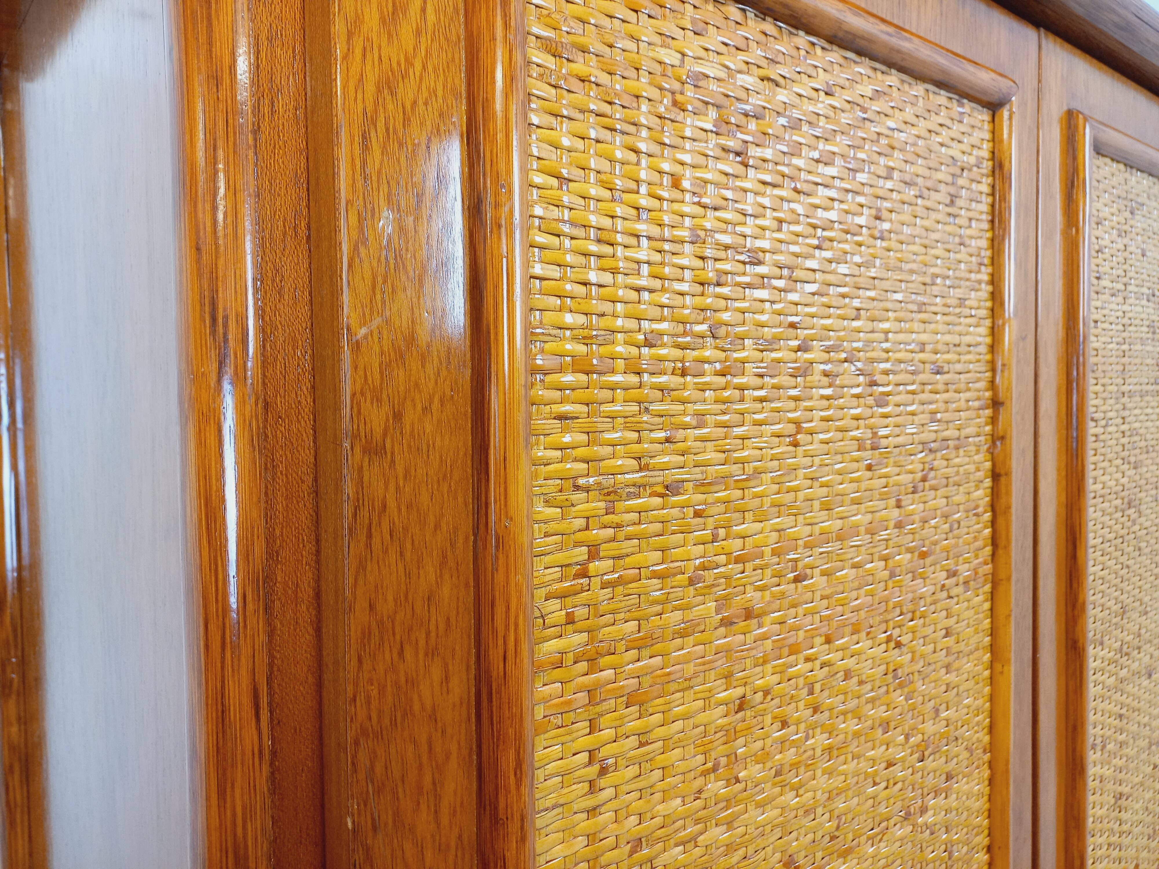 Vintage woven rattan and wood armoire by Maugrion for Roche-Bobois.