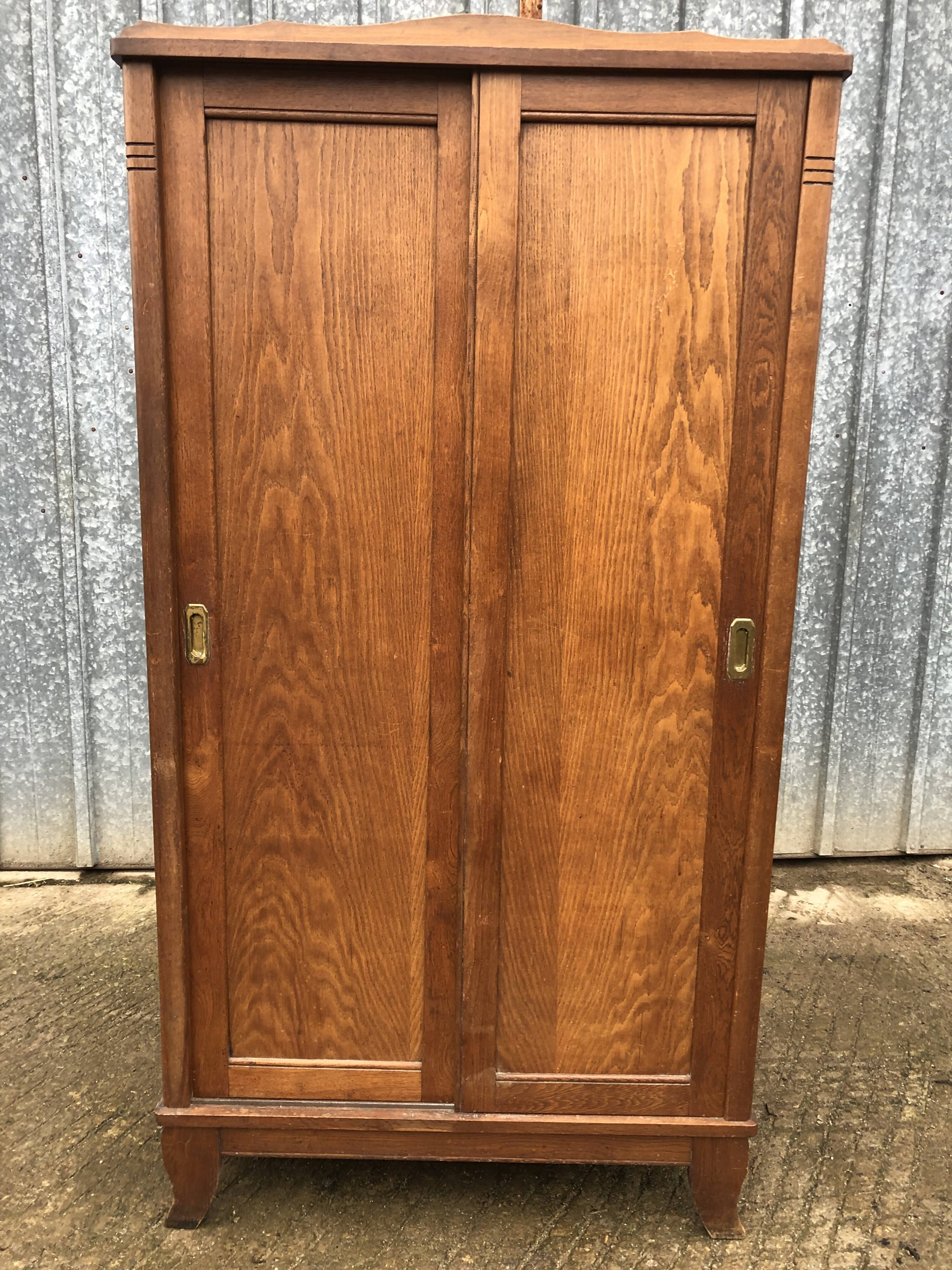 Vintage reconstruction period oak wardrobe with 2 sliding doors.