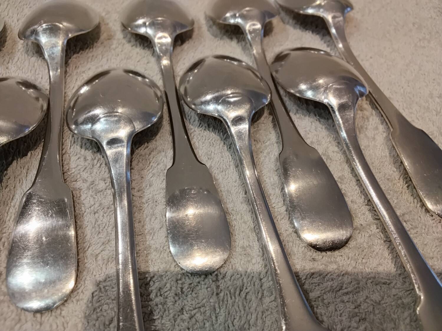 11 silver-plated dessert spoons by Christofle, Cluny pattern, striped