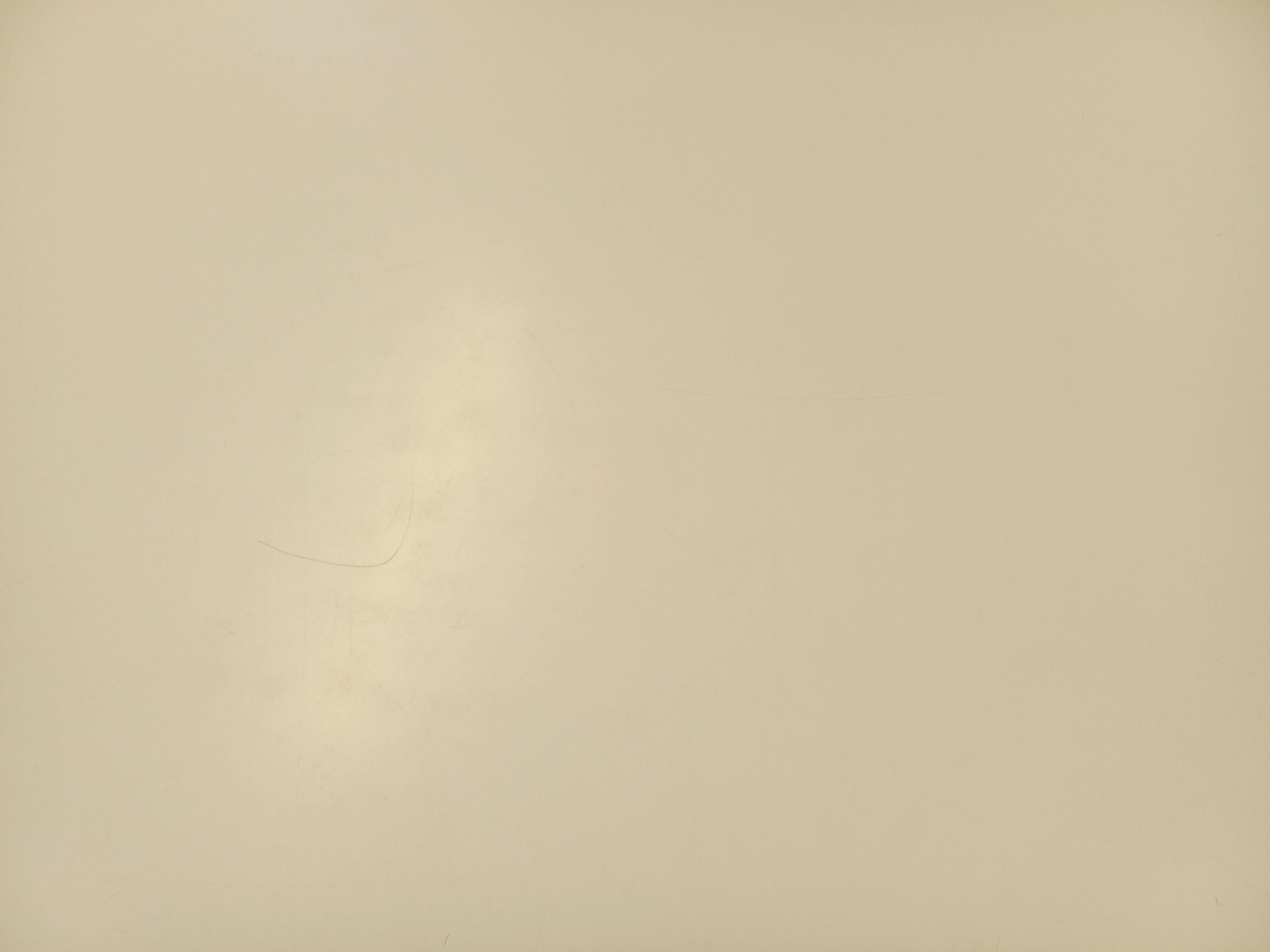 Vintage Eames round table for Vitra in white melamine, wood, and metal.