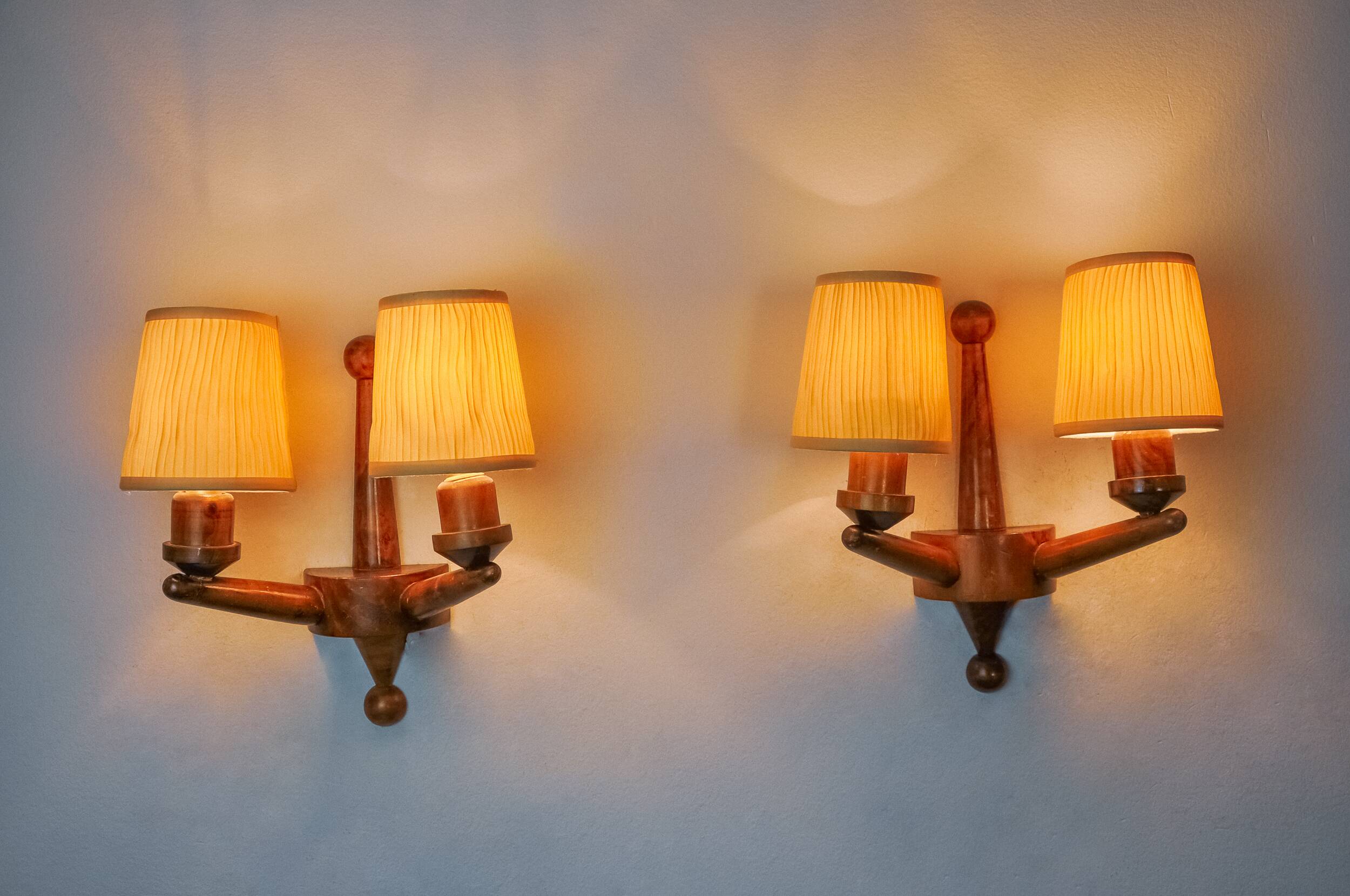 Pair of two-armed art deco wall lights, carved wood, France, 1960
