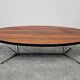 Danish Mid Century Modern oval coffee table with a teak top and chrome legs.