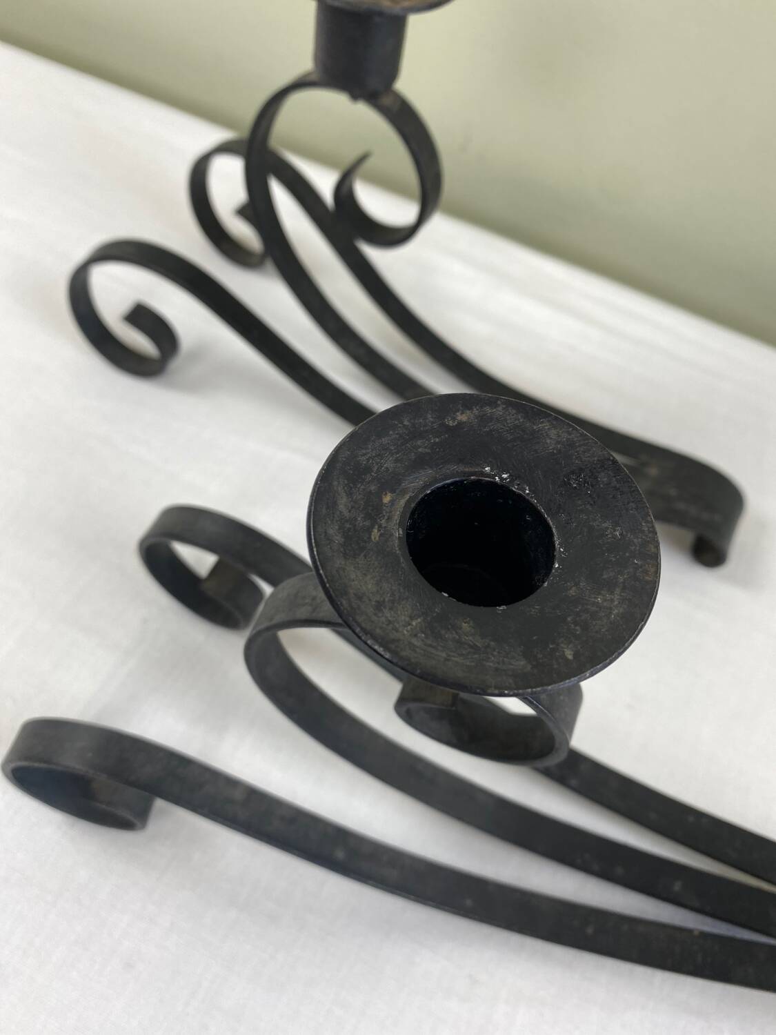 Pair of wrought iron candlesticks