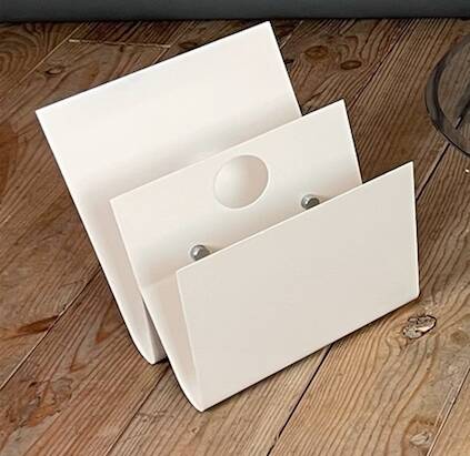 White lacquered metal magazine rack from the 1970s