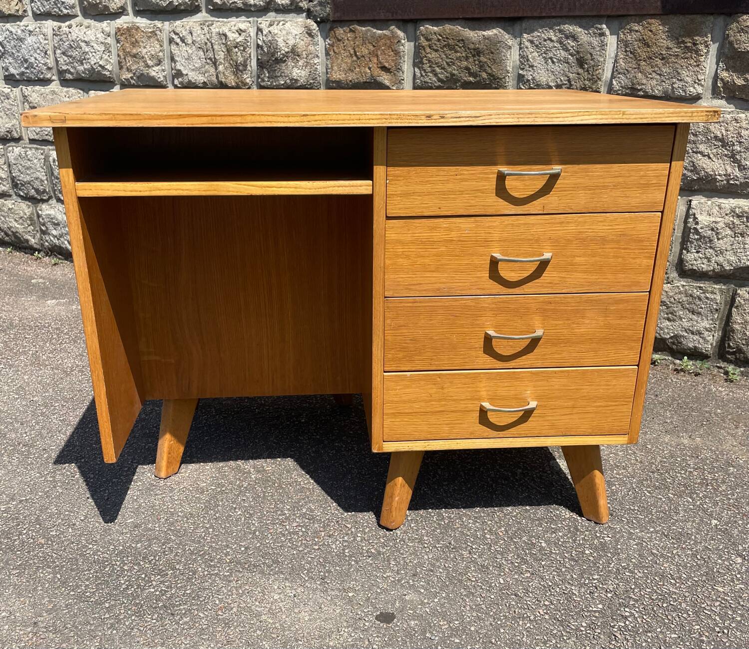 Double-sided desk with compass legs.