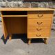 Double-sided desk with compass legs