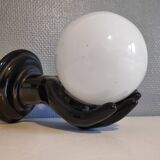 Black ceramic handand white opaline ball sconce