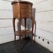Oval bedside table in Louis XV style made of mahogany.
