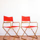 Red vintage pair of lafuma folding chairs