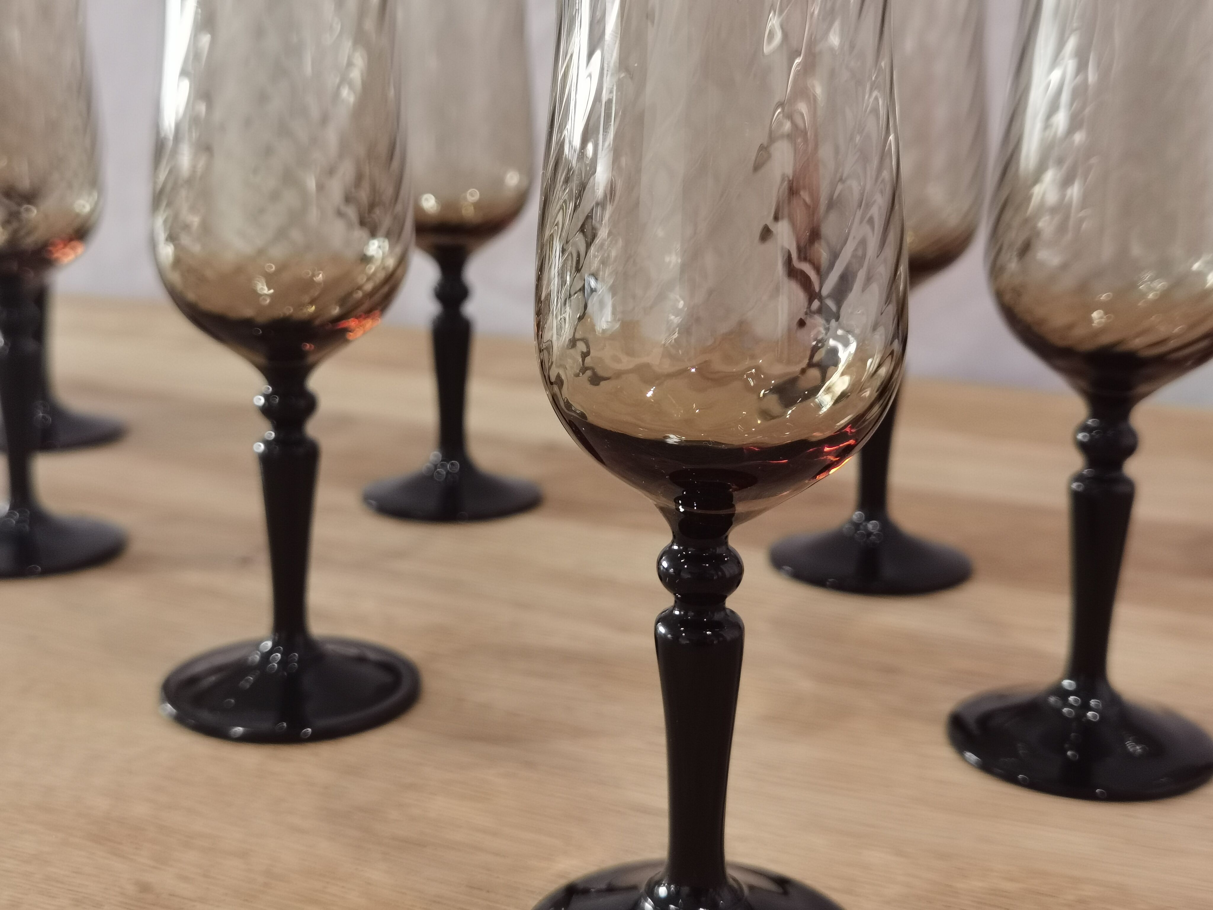 8 vintage smoked champagne flutes with black feet Arcoroc