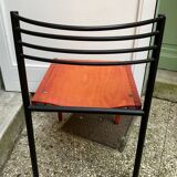 Chair with wooden seat and rare steel back