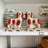 Pair of Staffordshire porcelain Cavalier King Charles dogs on terrace, 19th century.