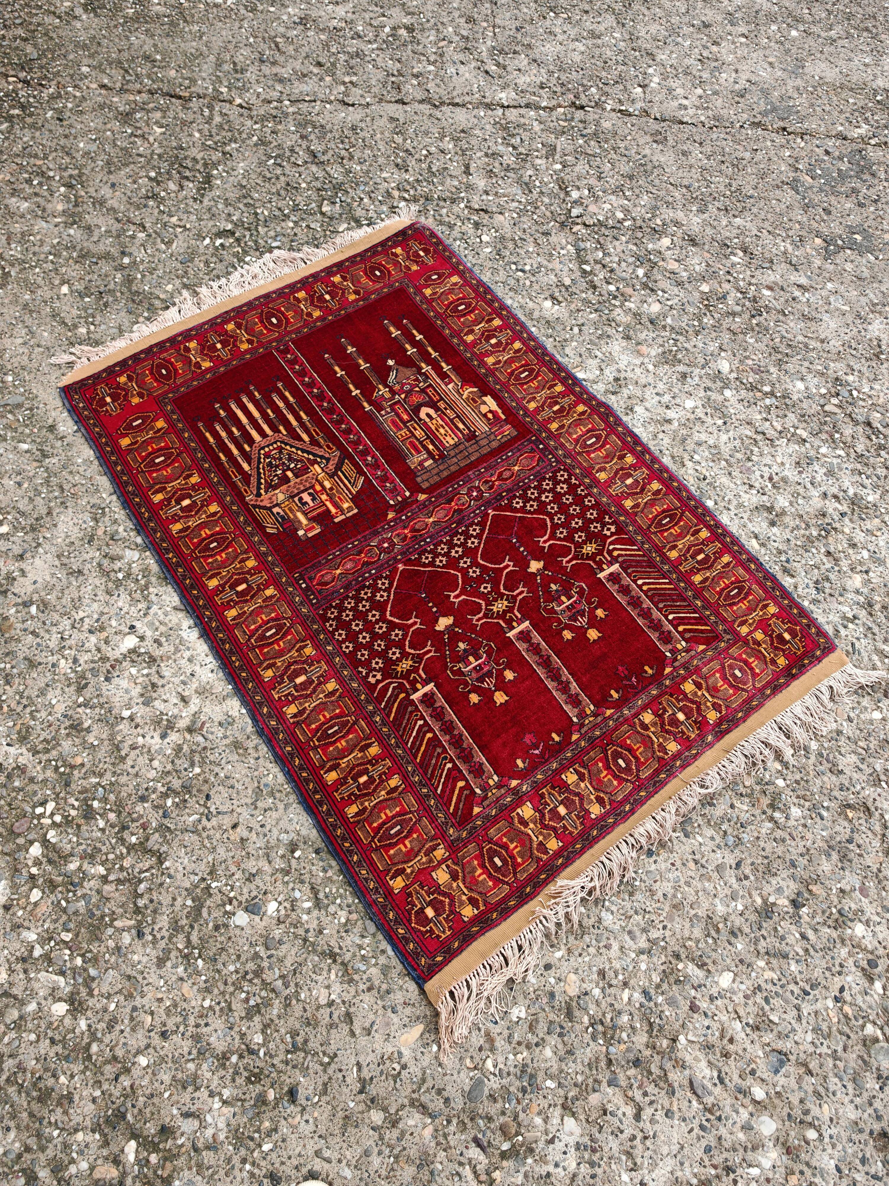 Vintage Afghan hand-knotted prayer rug with Islamic patterns.