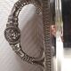 Silver-plated service tray with handles, neoclassical decoration.