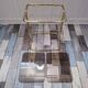Pair of vintage smoked glass and brass bedside tables