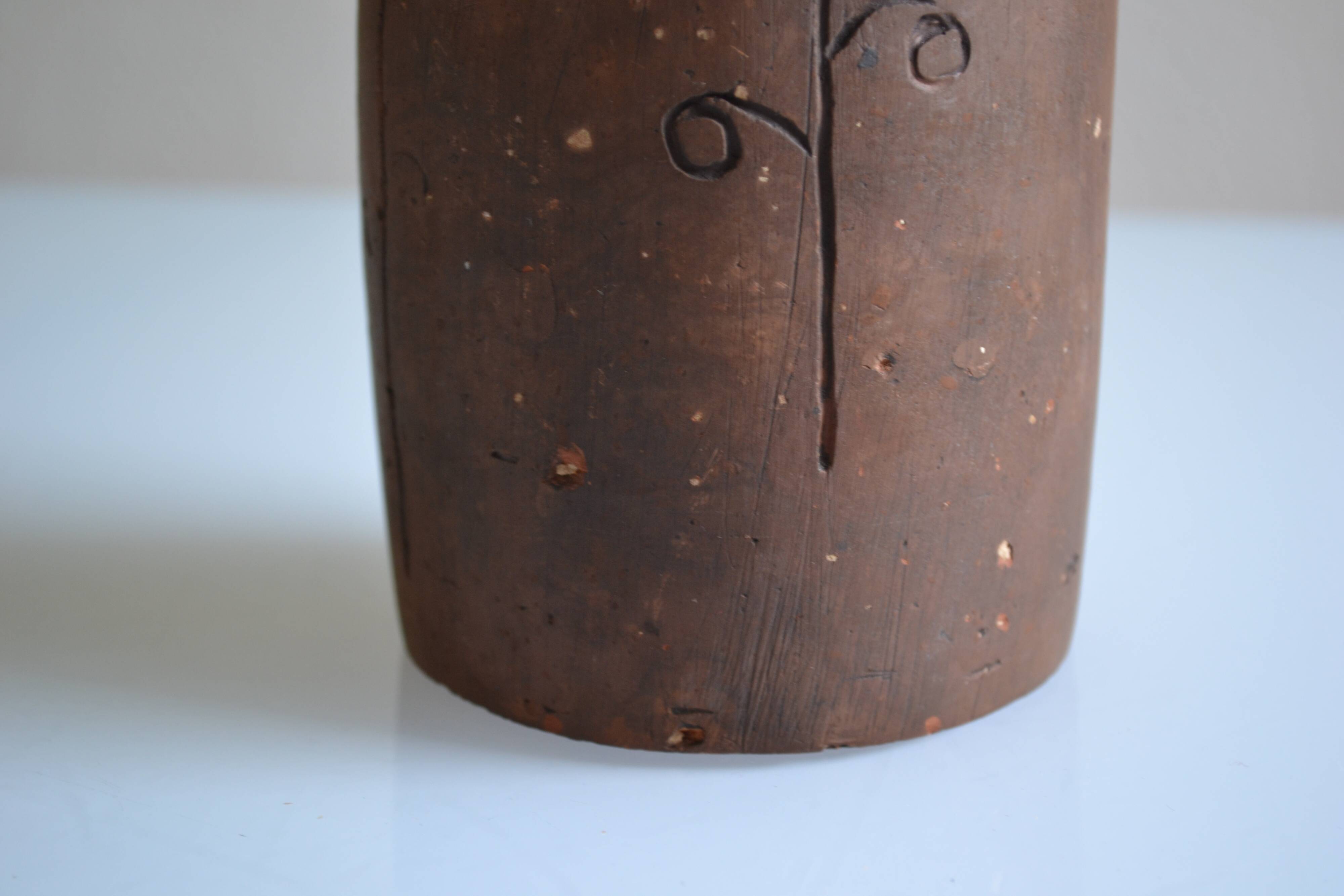 Bottle vase decorative flowers ceramic signature with fish to identify.