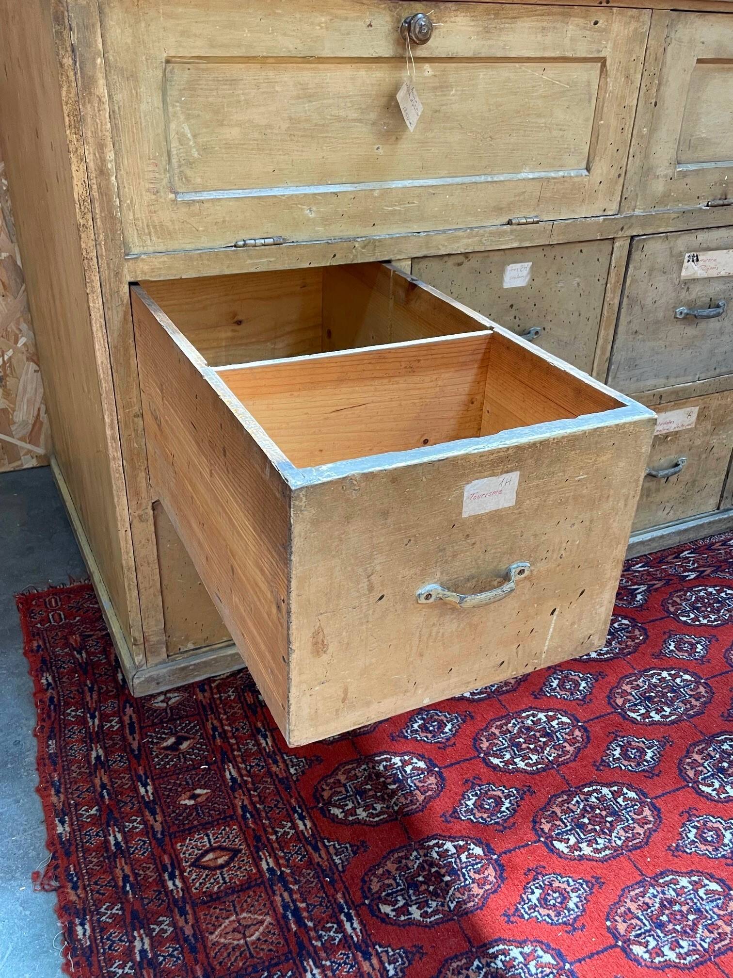 Old workshop furniture in good condition. 8 drawers and 2 drop-down doors, very