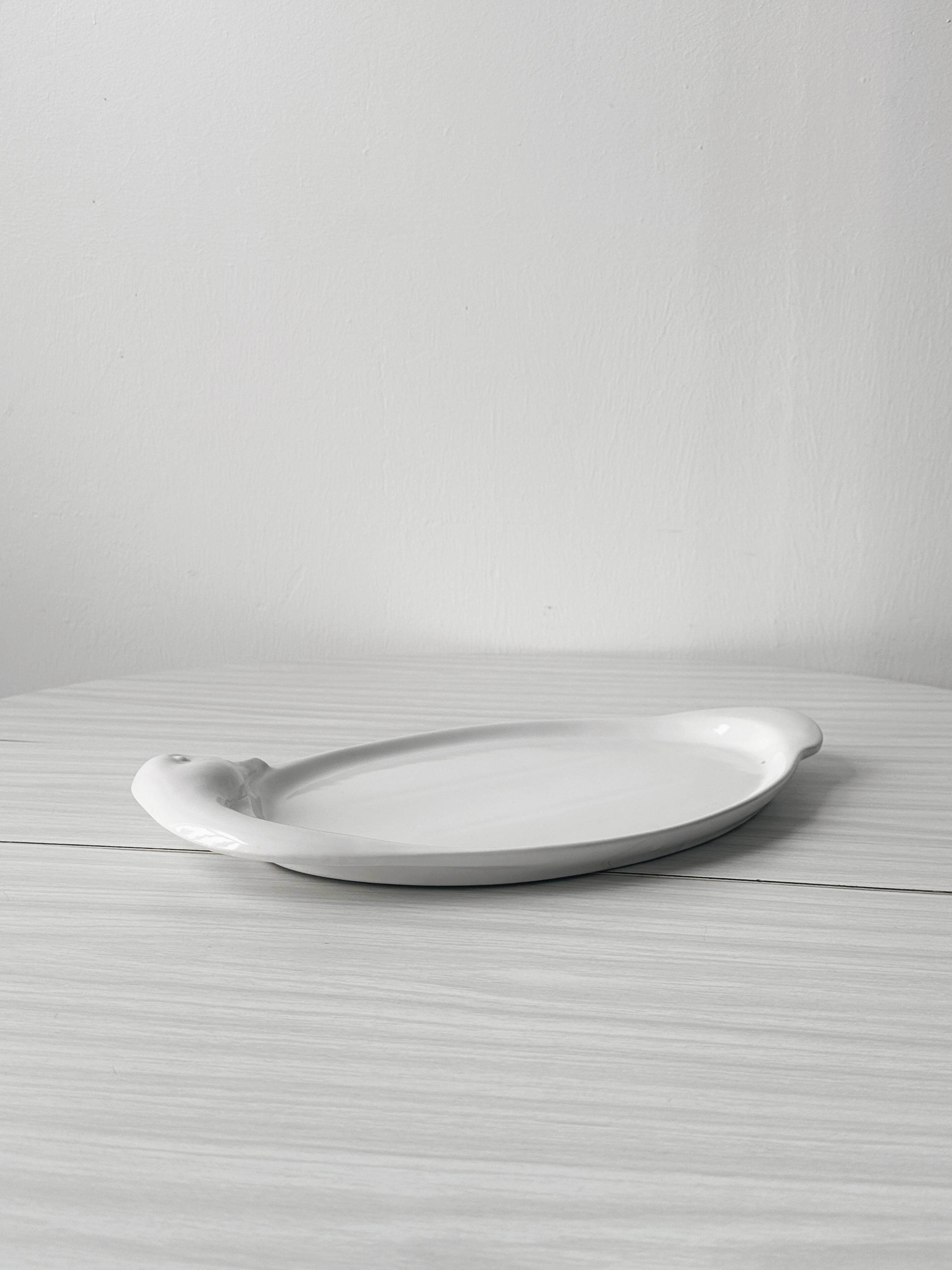 Porcelain goose serving dish.