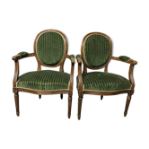 Paire de cabriolets fauteuils Louis XVI vert