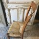 Chaise basse paillée de nourrice en merisier