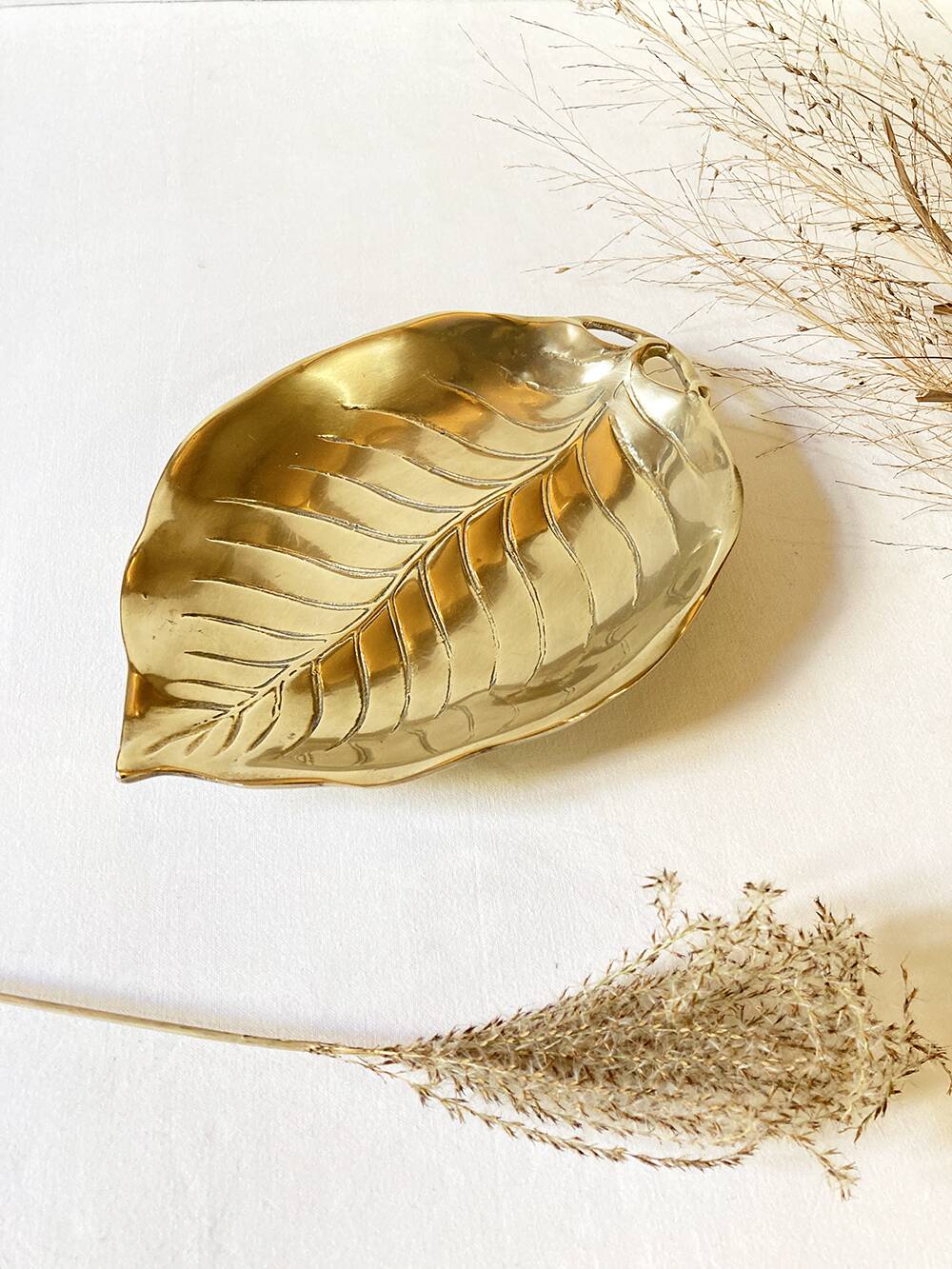 Brass pocket emptier