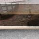 Table basse à deux niveaux verre et laiton