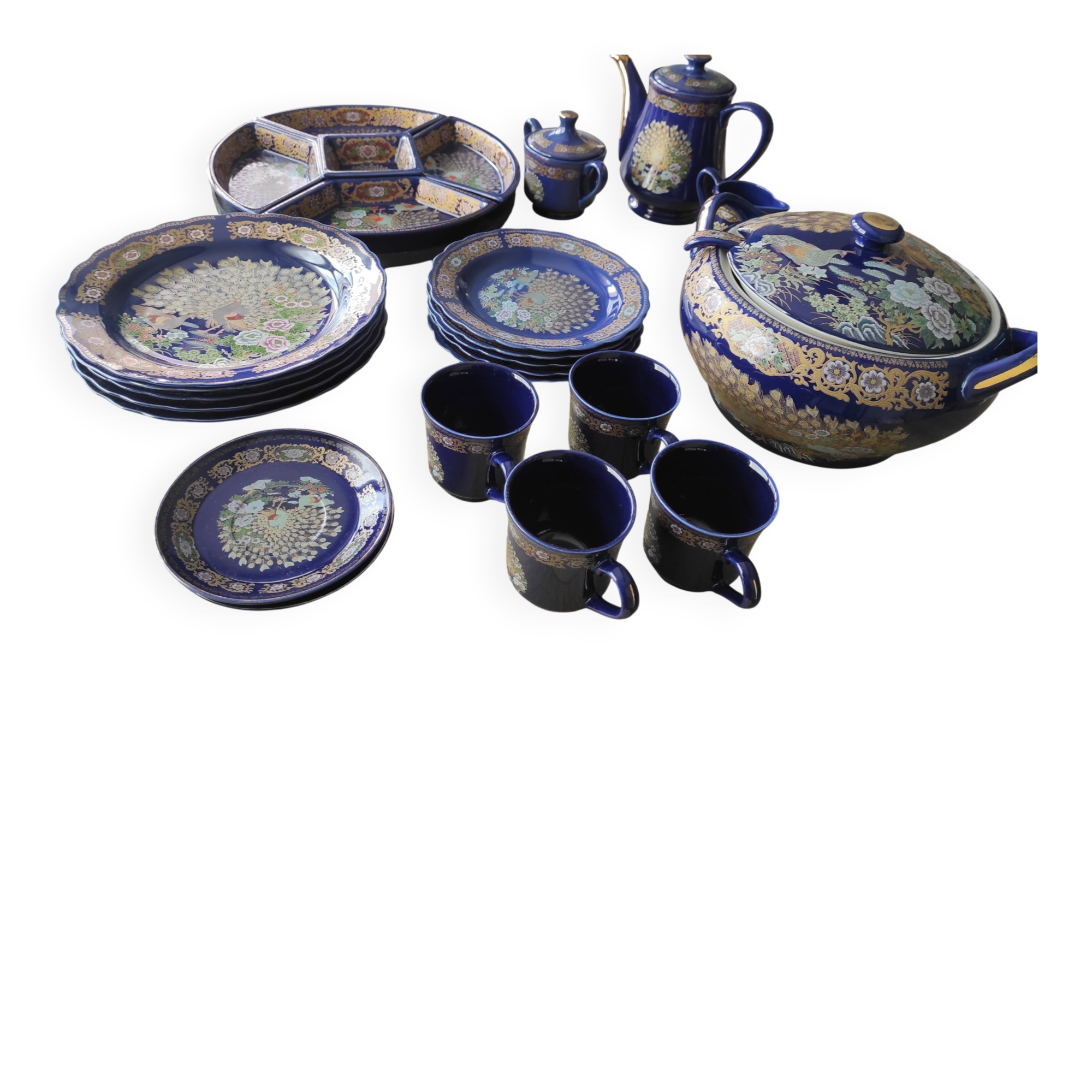 Vintage blue Taous dinnerware set of 21 pieces in very good overall condition.