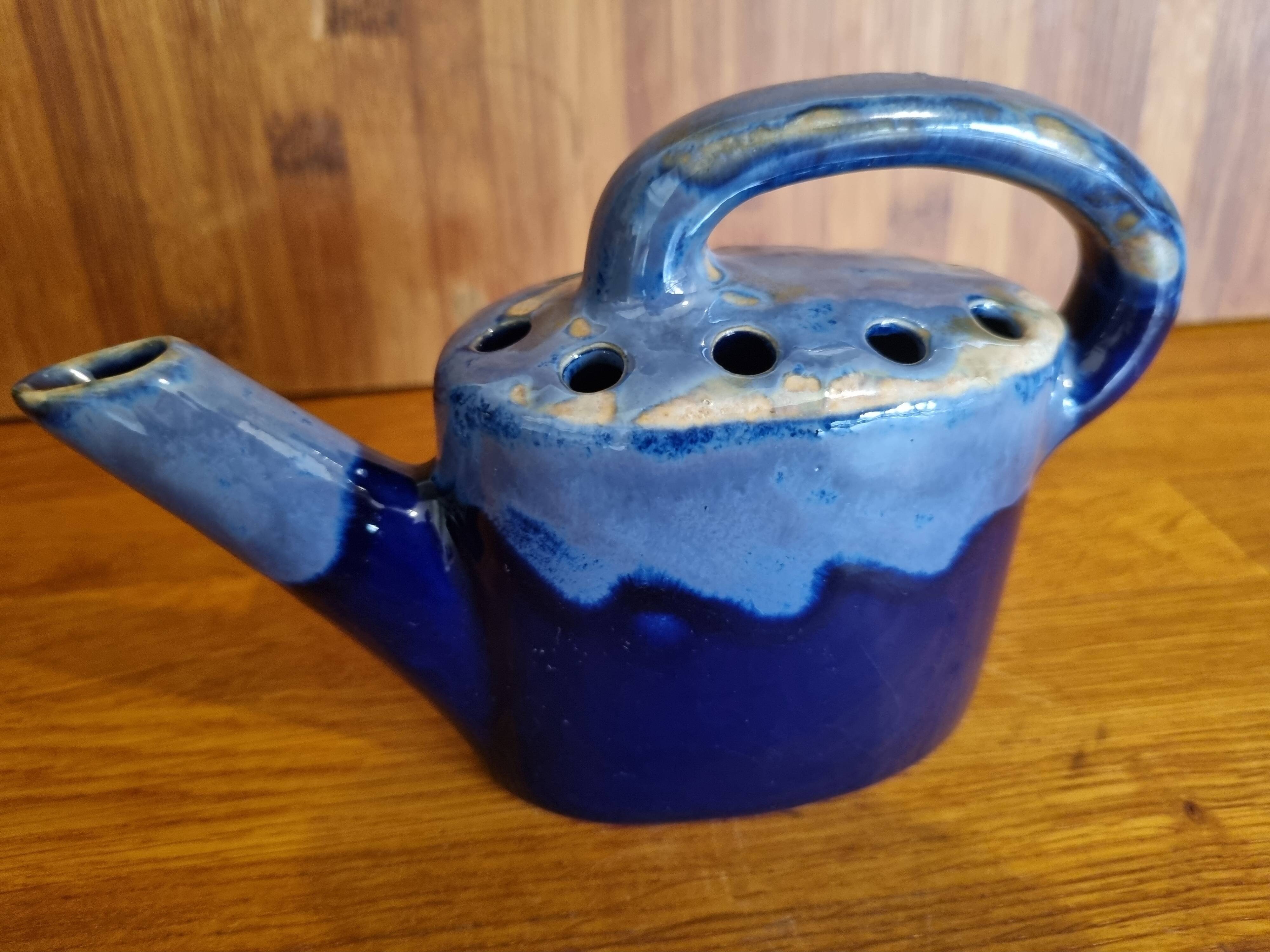 Blue flamed stoneware watering can flower stand