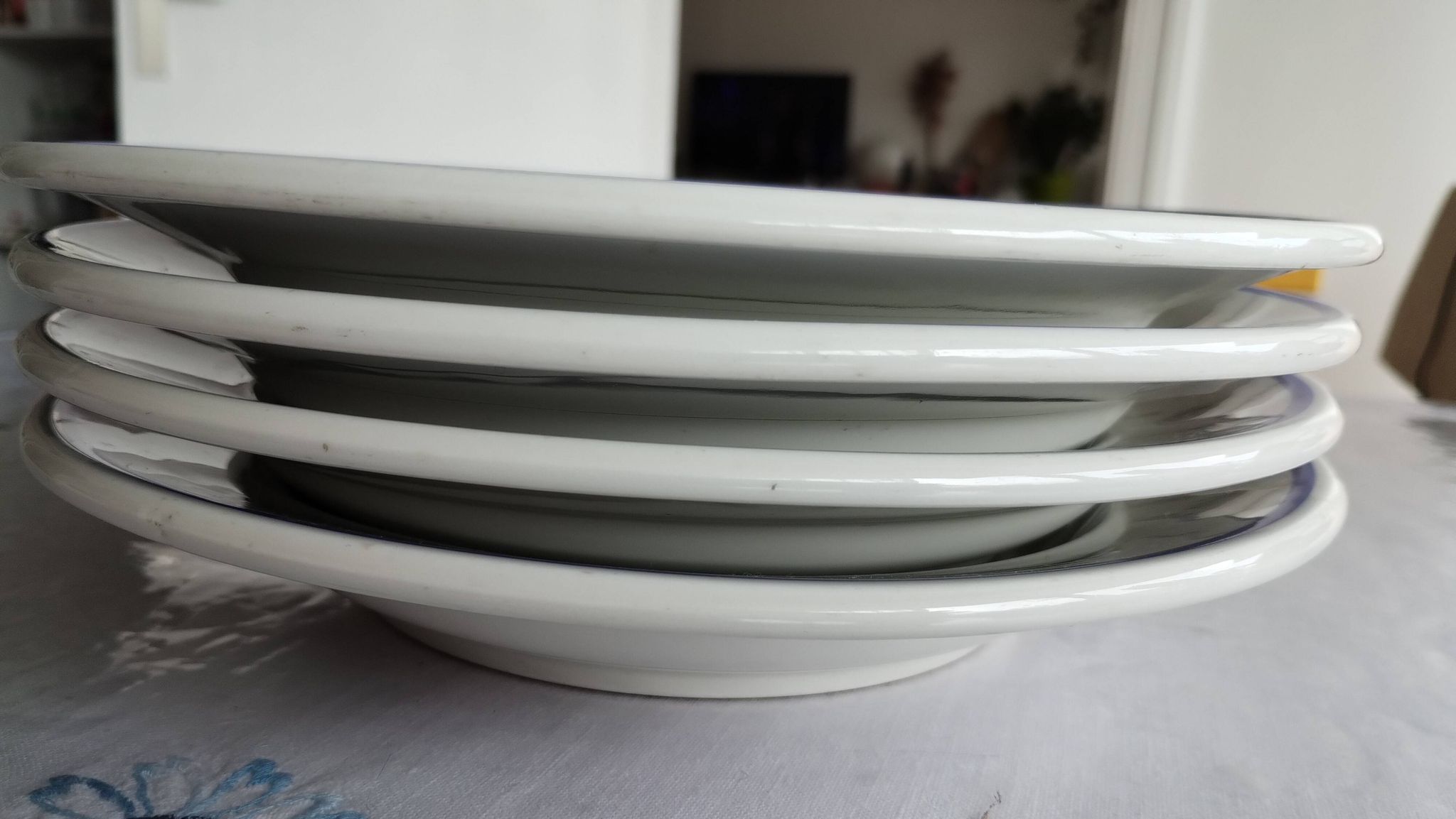 3 Pillivuyt white porcelain dinner plates with blue edging.