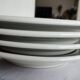 3 Pillivuyt white porcelain dinner plates with blue edging.
