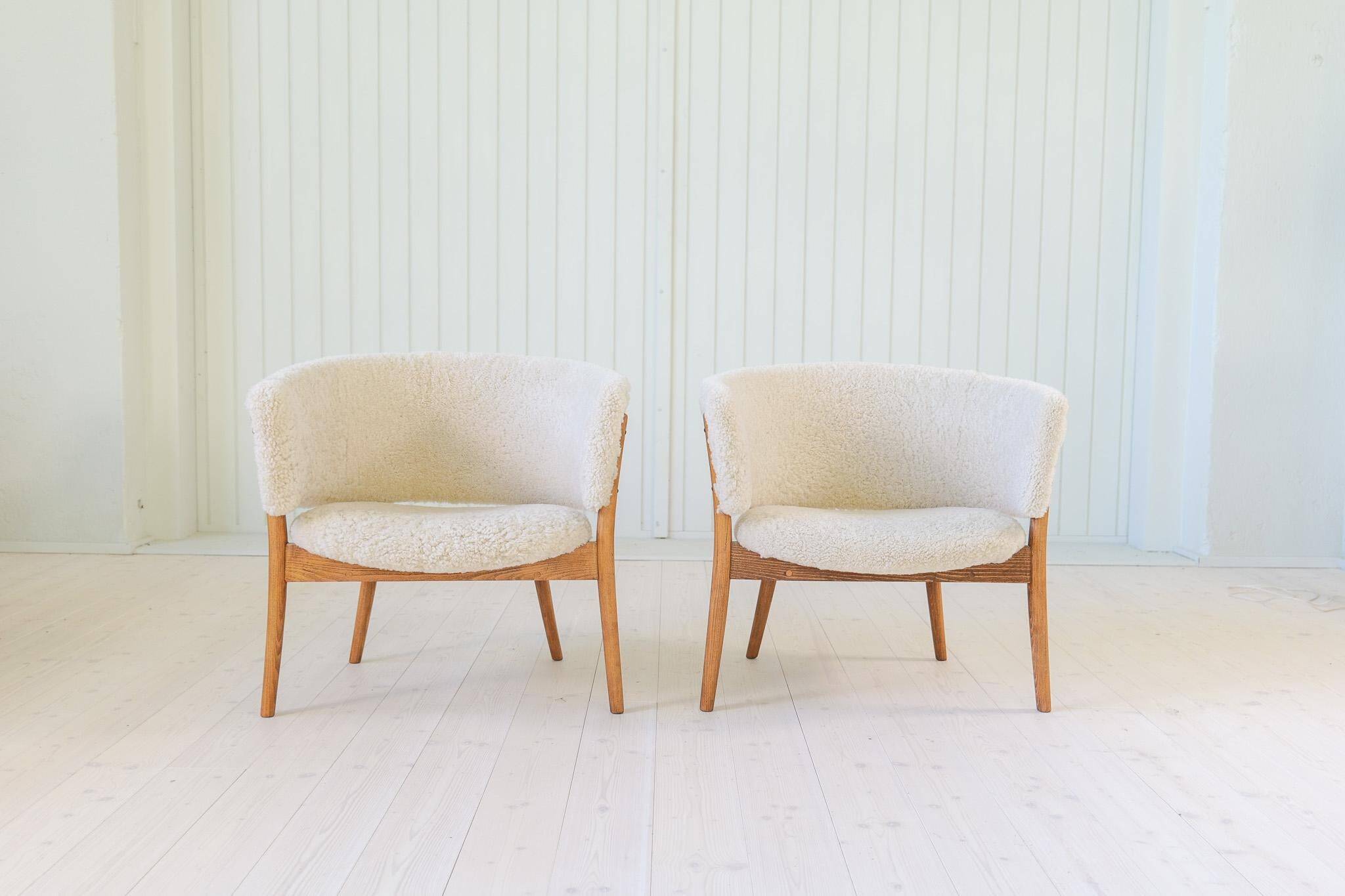 Mid-century lounge chairs in sheepskin/shearling and stained wood, Sweden, 1962.