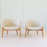 Mid-century lounge chairs in sheepskin/shearling and stained wood, Sweden, 1962.